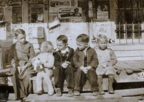 kids-sitting-on-the-front-stoop-of-the-kicklighter-store-hencart-road-tattnall-county-ga-circa-1937-photograph-copyright-bobby-c-kicklighter
